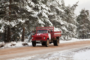 Old soviet fire truck in winter forest