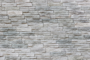 Gray slate wall stone background or texture.