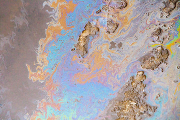 Fototapeta na wymiar Dirty puddle with oil slick texture background