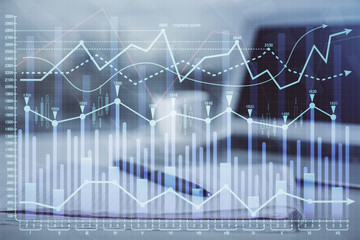 Double exposure of financial graph drawings and desk with open notebook background. Concept of forex market