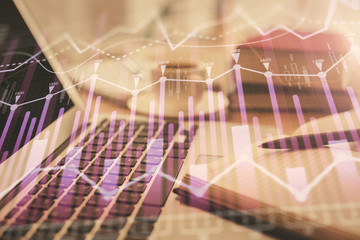 Double exposure of financial chart drawing and desktop with coffee and items on table background. Concept of forex market trading