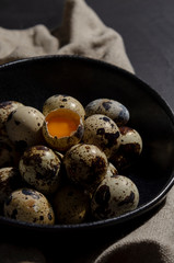 Fresh quail eggs. Rustic style on dark background