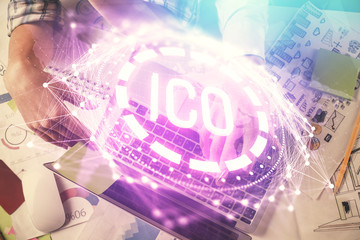 Double exposure of man and woman working together and crypto theme hologram drawing. Computer background. Blockchain concept. Top View.