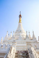 Fototapeta na wymiar Beautiful ancient white Buddhist temples, pagodas and stupas Migun, Myanmar Burma
