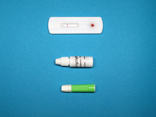 Coronavirus Antibody testing. COVID-19 antibody testing. Test result. At-Home kit on colored background.