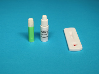 Coronavirus Antibody testing. COVID-19 antibody testing. Test result. At-Home kit on colored background.