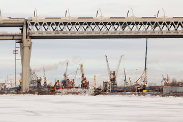 Automobile bridge over old factories on Kanonersky Island