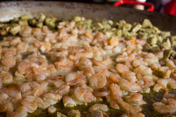 Traditional spanish paella with seafood and pork. Prepared
