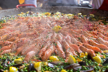 Traditional spanish paella with seafood and pork. Prepared