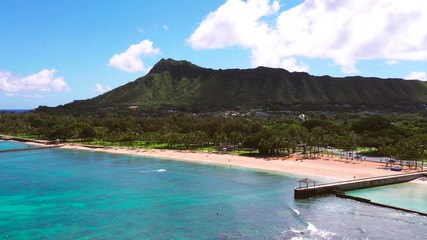 A photo of the shore and a mountain of Hawaii