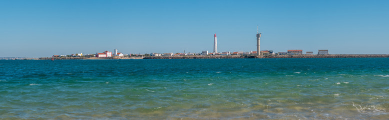Fototapeta na wymiar Panoramic view of Lighthouse on Culatra Island in Ria Formosa