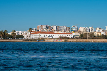 Fototapeta na wymiar Faro, Portugal - December 18, 2017: City of Faro view from the boat
