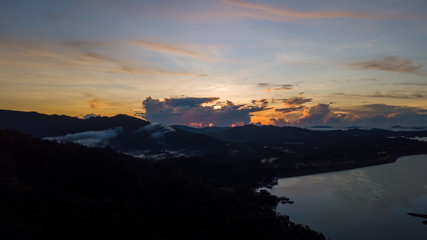Aerial view of Kenyir Lake during blue hour sunrise.