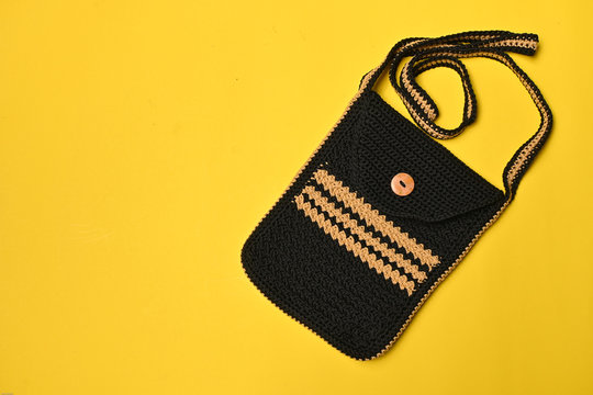 Sling bag crochet isolated on yellow background