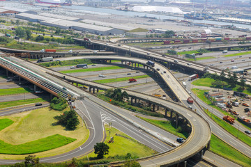Aerial view of empty highway interchange with disappearing traffic on a bridge and streets roads and lanes crossroads cars Newark NJ US