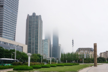 Obraz premium Urban architecture landscape in the fog in Qingdao, China