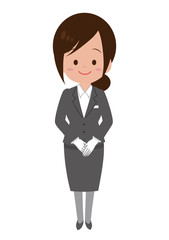 手を前で組んで立つ女性スタッフ