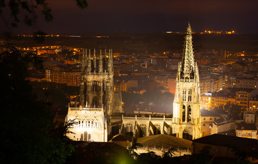 View of landmark of famous cathedral in Burgos city illuminated at dusk in Castilla Leon, Spain