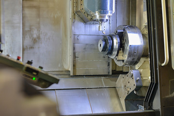 CNC machining center. The rough part after heat treatment is installed in a chuck for further cutting on a cnc machine.