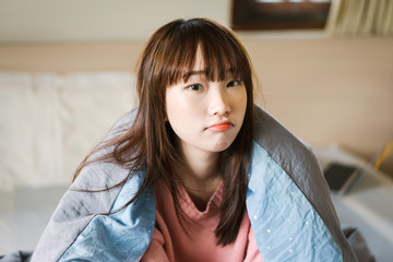 Naklejka premium Portrait young asian cute student woman wear pink sweater.