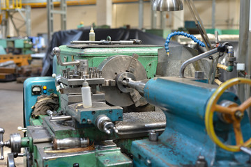 Tapping on a lathe, the tap cuts the hole by applying pressure from the tailstock.