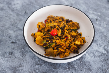 plant-based food, vegan moroccan cous cous with mediterranean vegetables and onions