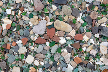 Multicolored colorful sea pebbles, natural background, texture. Close-up texture of colorful sea pebbles. Small Rock. Green glass pebbles