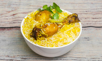 Chicken Biryani is a mixed rice dish with its origins among the Muslims of India. It can be compared to mixing a curry, later combining it with semi-cooked rice separately.