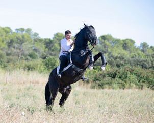 riding teenager and horse