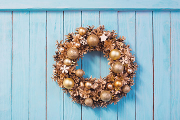 Christmas wreath on old blue  wooden background