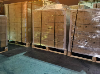 Shipment cartons box on wooden pallets in interior warehouse cargo storage for export and sorting goods in freight logistics and transportation industrial, road truck network