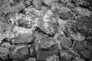 evocative image of black and white texture of ancient wall