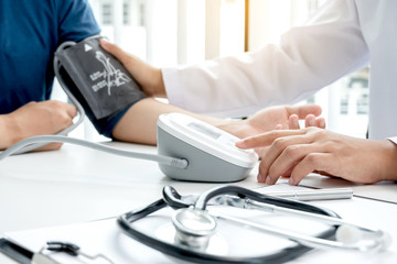 The doctor measured blood pressure, the patient examined the heartbeat and talked about health care...