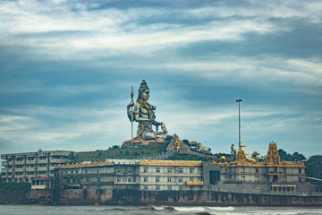 murdeshwar shiva statue morning view from low angle with sea waves