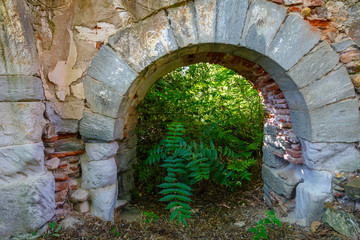 Stone arch. Ancient ruins Royal Monastery of Santa María de Nogales. San Esteban de Nogales, León, Spain.