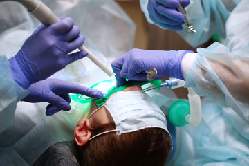 Surgery to remove and treat a child's teeth. The view from the top. Copy of the space. An...