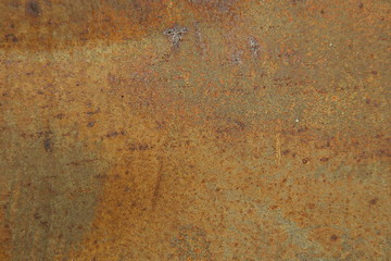Еexture of rusty iron, cracked paint on an old metallic surface, sheet of rusty metal with cracked and flaky paint, abstract rusty metal texture. Horizontal