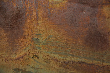 Еexture of rusty iron, cracked paint on an old metallic surface, sheet of rusty metal with cracked and flaky paint, abstract rusty metal texture. Horizontal