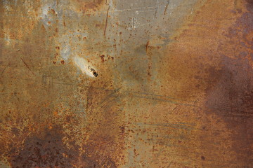 Еexture of rusty iron, cracked paint on an old metallic surface, sheet of rusty metal with cracked and flaky paint, abstract rusty metal texture. Horizontal