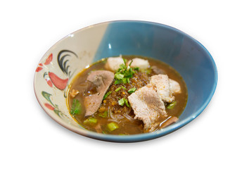 Close up of noodles with pork and pork balls with soup die cut on white isolated, focus selective.