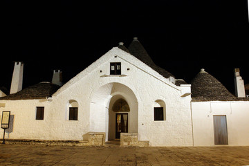Fototapeta premium Alberobello, Italy - October 6, 2010: the characteristic houses called trulli
