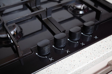 Knobs control gas stove close-up