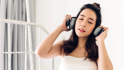 Naklejka premium Smiling of cheerful beautiful pretty asian woman clean fresh healthy white skin posing in white clothes.Girl felling relaxing and enjoy time at home.asia beauty