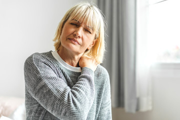 Sick senior adult elderly women touching the neck have shoulder and neck pain.Healthcare and...