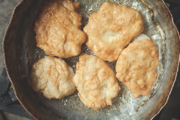 The process of cooking. Cooking round frying in oil