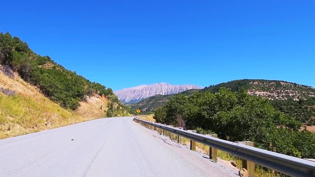 Slow motion pov point of view driving in car on scenic road in Colorado on Million Dollar Highway 550 at San Juan national forest with canyons on route from Ouray to Durango