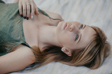 Portrait of beautiful young woman from unusual angle
