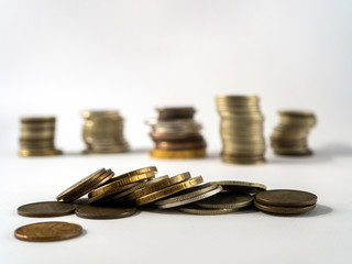 Copper and silver coins in bulk and heaps on a white background. Money background with clean space for text.