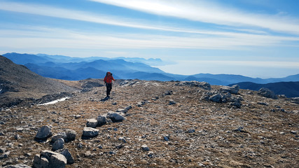 Men hiking on the top of Cervati mountain in Cilento National Park