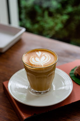 coffee latte art on table in coffee shop.